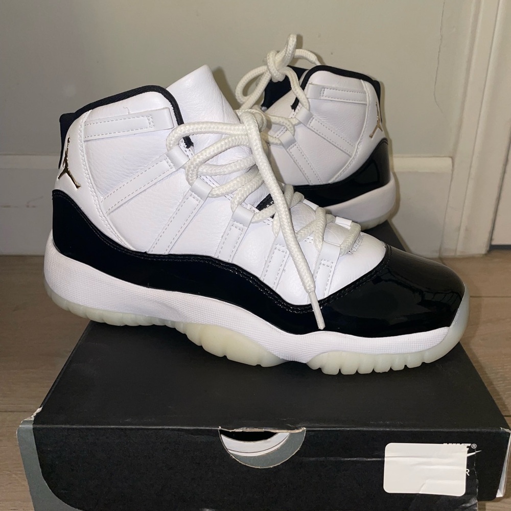 Jordan Retro 11 White and Black High-Top Sneakers